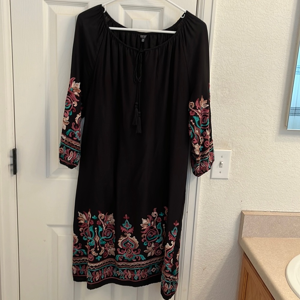 Beautiful black peasant sheath dress with embroidered sleeves and bottom.